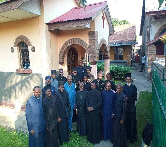 Clergy gathering together to learn about the Cutting & Sewing Project.